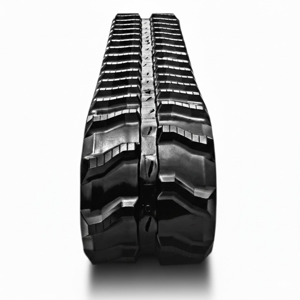 Front view of an S-lug rubber track tread pattern, highlighting its design for traction and durability on skid steers and mini excavators.
